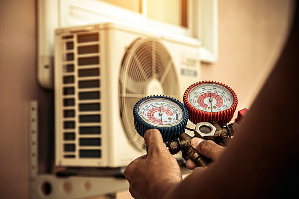 Professional Heat Pump Repair technician working in Tallassee, AL